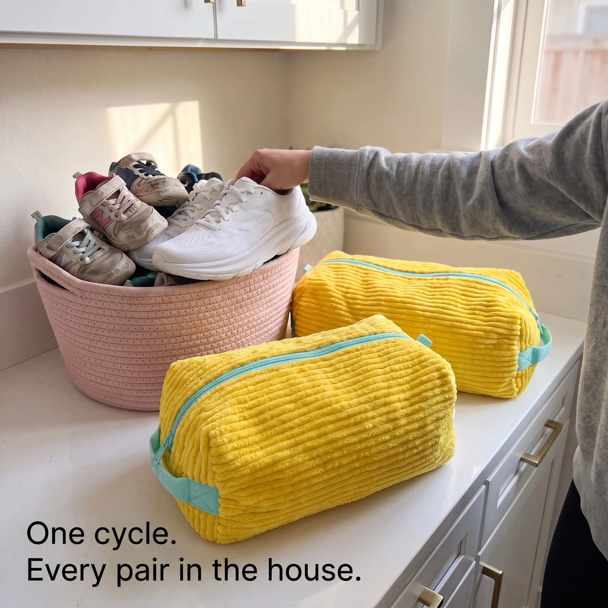 Two CocoonWeaves™ next to a basket of the family's sneakers. One cycle, every pair in the house.