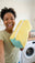 A woman holding the CocoonWeave™ in her laundry room